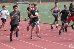 (Danielle Smith | Trojan Times) The JV and varsity teams conduct practices alongside each other as they prepare for their separate Oahu Interscholastic Association championships, where they are eligible to qualify for the state competition in Maui. 