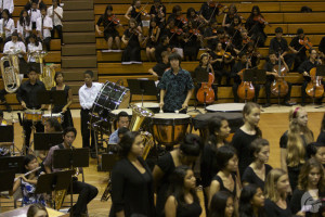 (Shaina Telford | Trojan Times) Ensemble members from chorus, band and orchestra participated in a collaborative finale number at the Fall Pops concert on Sept. 22 in the gym.