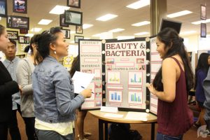 (Danielle Smith | Trojan Times) (L-R): Jeni Nishimura and Kelsea Hernandez-Young (12). While most of the projects were done independently, students were still able to gain the help of their science teachers in hope of perfecting their projects completely.