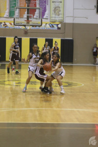 (Scott Alquisa | Na Manao Poina Ole) Defending against Farrington, Guard Jazmina Lafitaga (12) holds the team together, as a supportive leader on and off the courts.